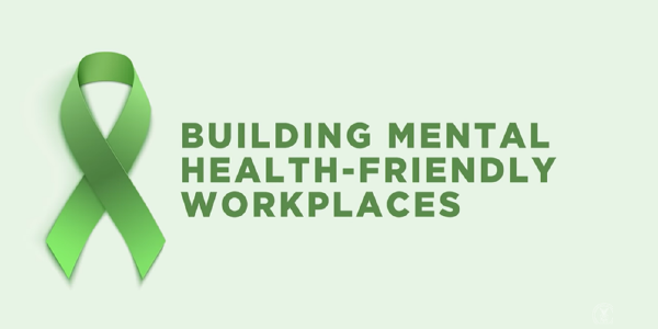 Building mental health-friendly workplaces. Green ribbon.