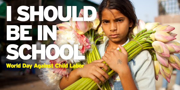 A young girl in India carries cut flowers to sell. The text reads "I should be in school. World Day Against Child Labor."
