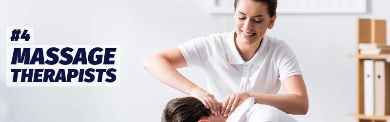 A female masseuse massages the neck of a man in an office environment.