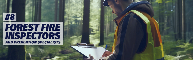 A man wearing a high visibility vest takes notes on a clipboard in the forest.